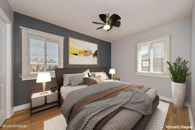 bedroom featuring ceiling fan and light hardwood / wood-style flooring