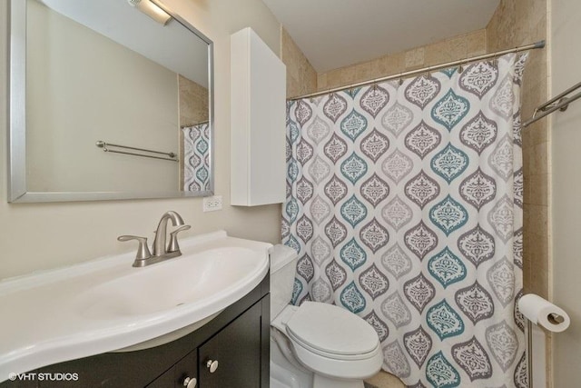 bathroom with vanity, a shower with curtain, and toilet