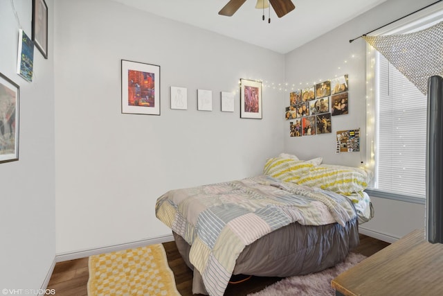 bedroom with ceiling fan and hardwood / wood-style floors