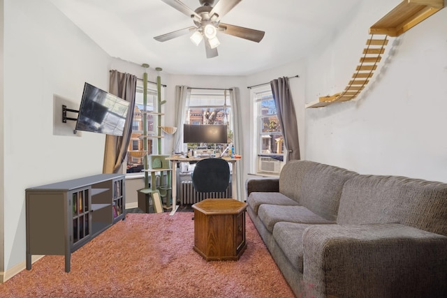 carpeted living room featuring radiator heating unit and ceiling fan