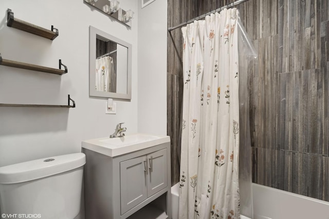 full bathroom with vanity, shower / bath combination with curtain, and toilet