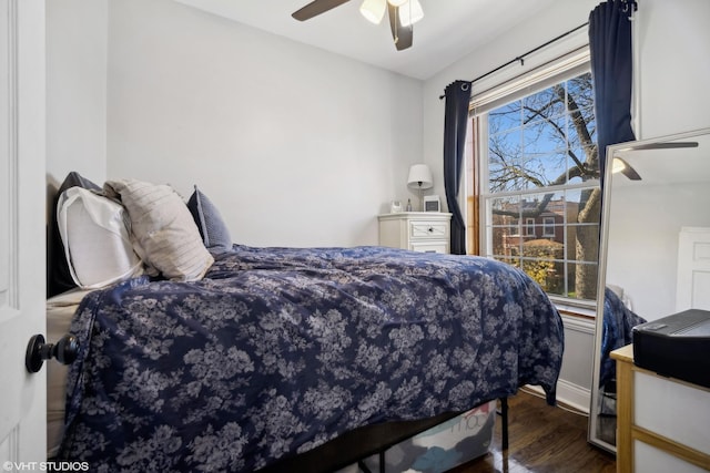 bedroom featuring ceiling fan and dark hardwood / wood-style flooring