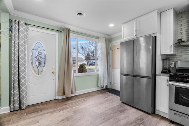 interior space featuring light wood-type flooring and crown molding