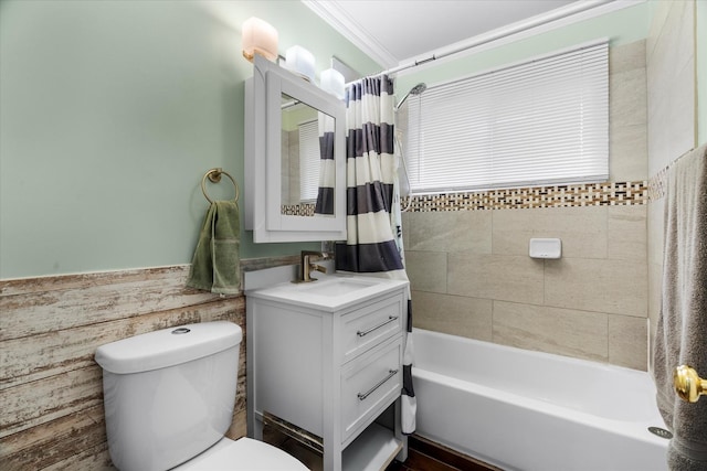 full bathroom featuring shower / tub combo, vanity, toilet, and crown molding