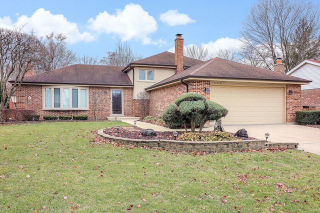 view of front of home with a front lawn and a garage