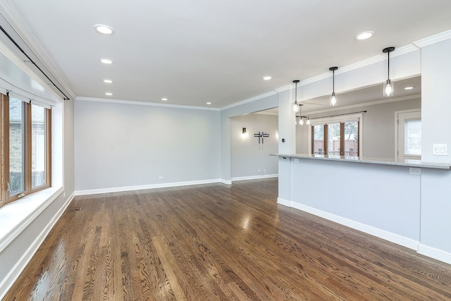 unfurnished living room featuring dark hardwood / wood-style flooring and ornamental molding