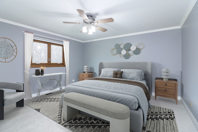 carpeted bedroom with ceiling fan and crown molding