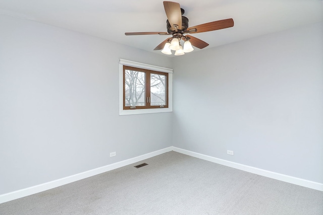 empty room with carpet flooring and ceiling fan