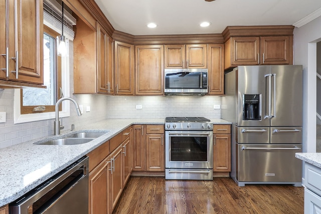 kitchen with decorative backsplash, light stone countertops, dark hardwood / wood-style flooring, stainless steel appliances, and sink