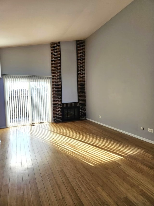 unfurnished living room featuring hardwood / wood-style floors