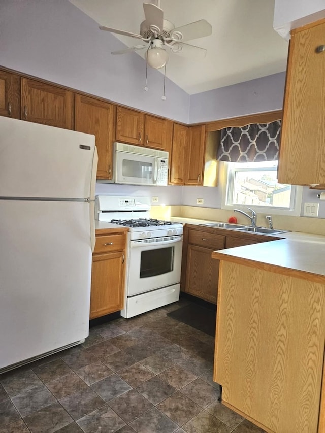 kitchen featuring ceiling fan, sink, and white appliances