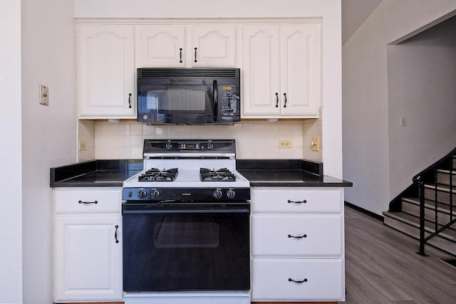 kitchen with backsplash, white cabinetry, hardwood / wood-style floors, and range with gas stovetop