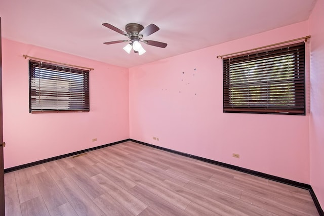 unfurnished room featuring ceiling fan and light hardwood / wood-style floors