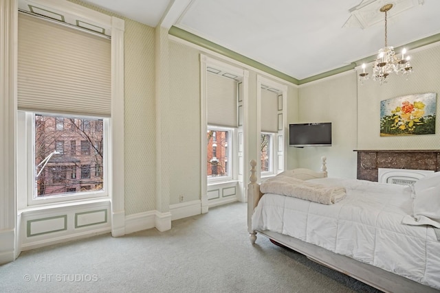 bedroom featuring wallpapered walls, carpet floors, and a chandelier