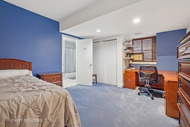 bedroom with recessed lighting, a closet, and carpet flooring