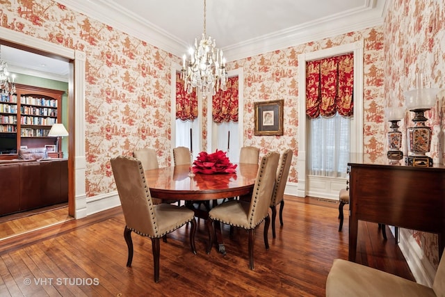 dining area featuring wallpapered walls, an inviting chandelier, and crown molding