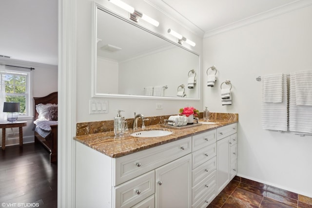 bathroom with vanity and crown molding