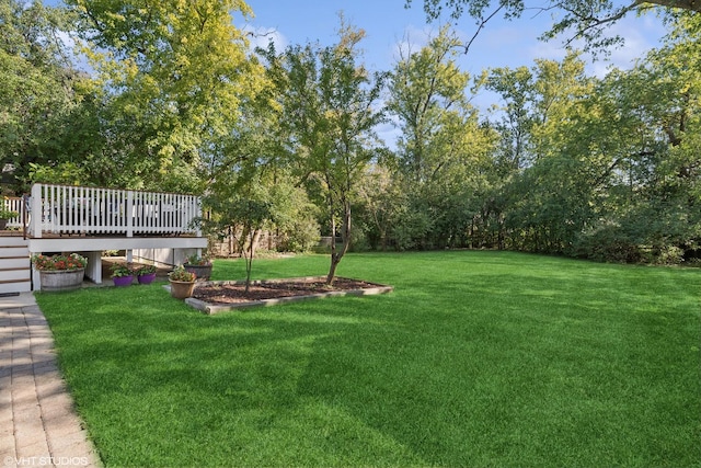 view of yard featuring a wooden deck