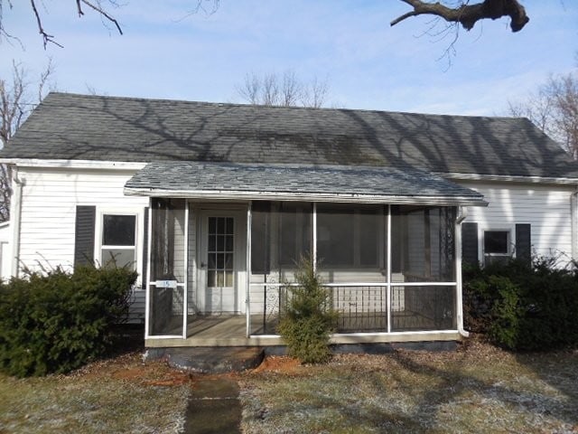 view of front facade featuring a sunroom