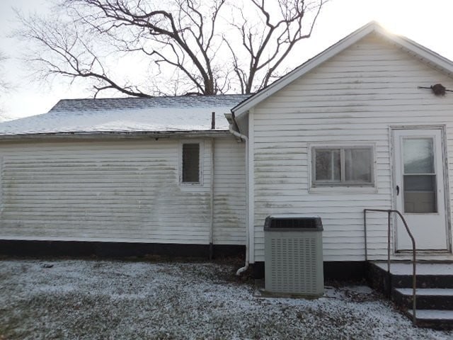 view of home's exterior with cooling unit