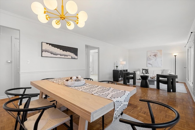 dining space featuring an inviting chandelier, crown molding, and dark parquet floors