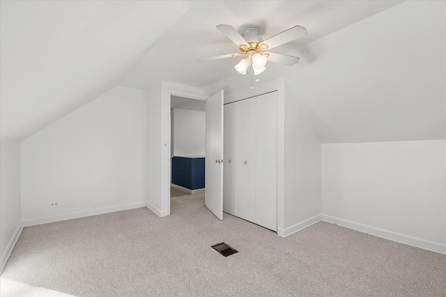 bonus room with lofted ceiling, light colored carpet, and ceiling fan