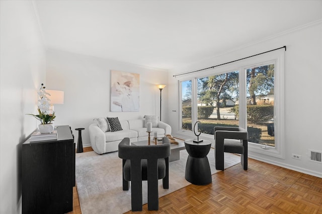 living room featuring light parquet floors and ornamental molding