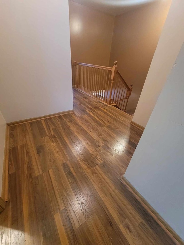 stairs featuring hardwood / wood-style flooring