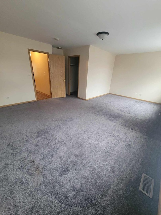 empty room featuring carpet flooring