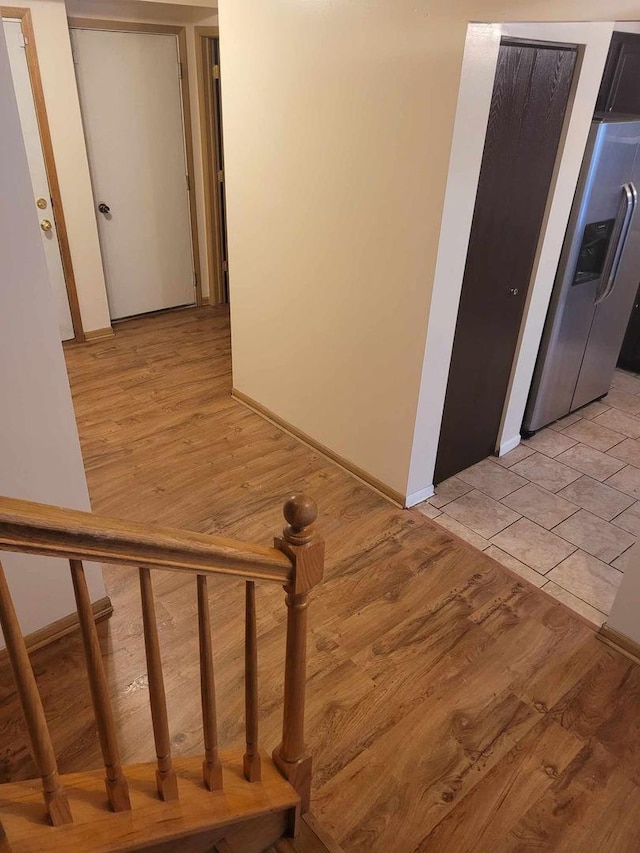 stairway featuring tile patterned floors