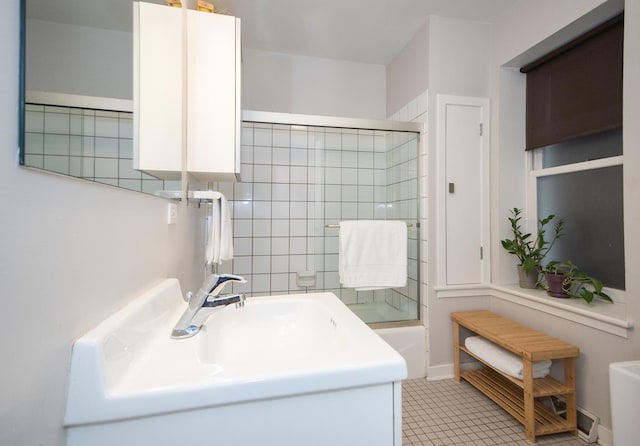 bathroom featuring tile patterned floors and  shower combination