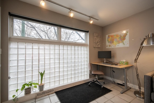 office area featuring light tile patterned flooring and rail lighting