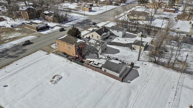 snowy aerial view featuring a residential view