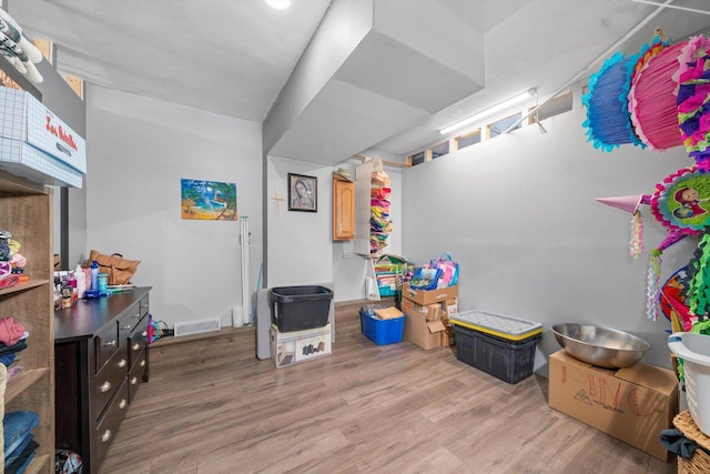 recreation room with light wood-type flooring and visible vents