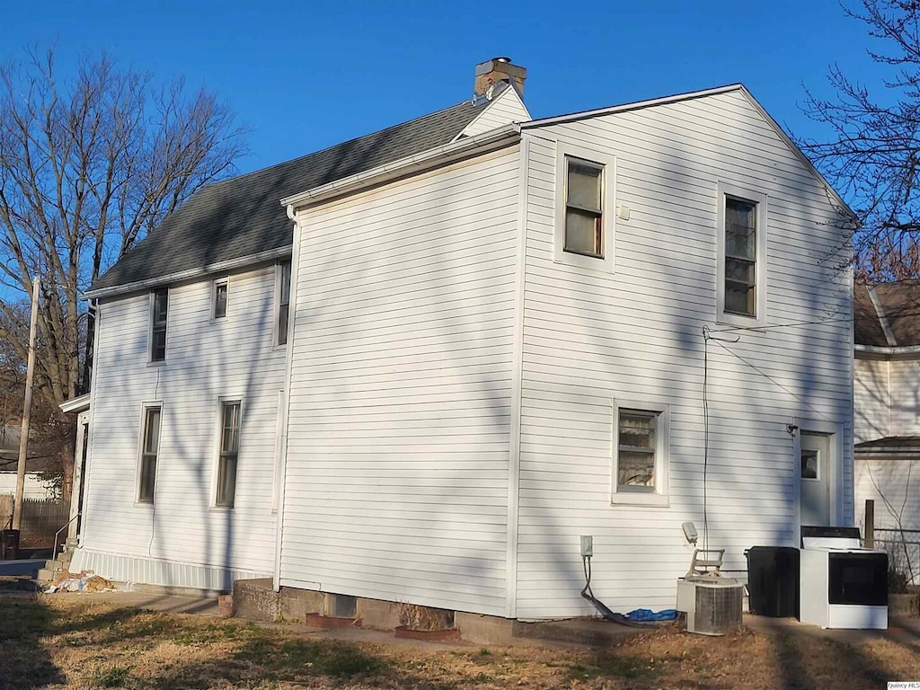 view of home's exterior featuring central AC unit