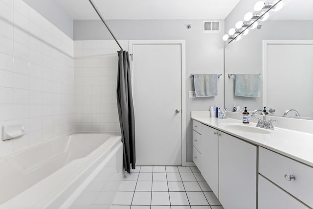 bathroom featuring tile patterned flooring, shower / bath combo, and vanity