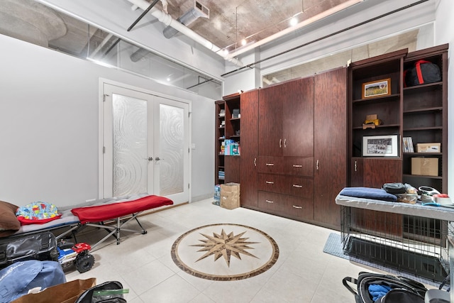 miscellaneous room featuring light tile patterned floors