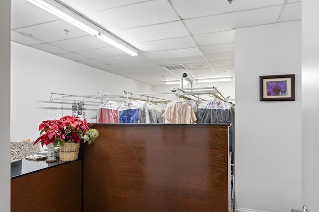 walk in closet with a drop ceiling