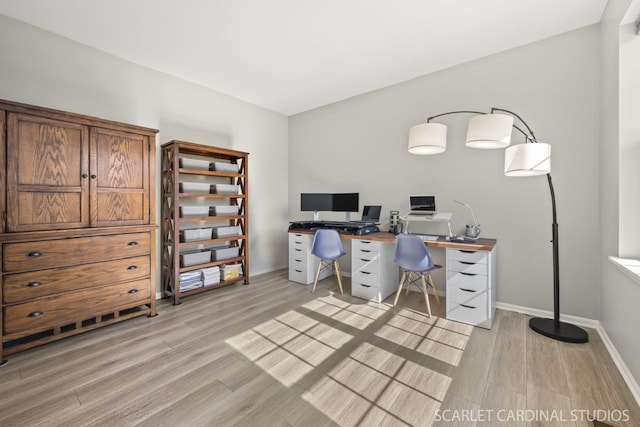 office space with light wood-type flooring