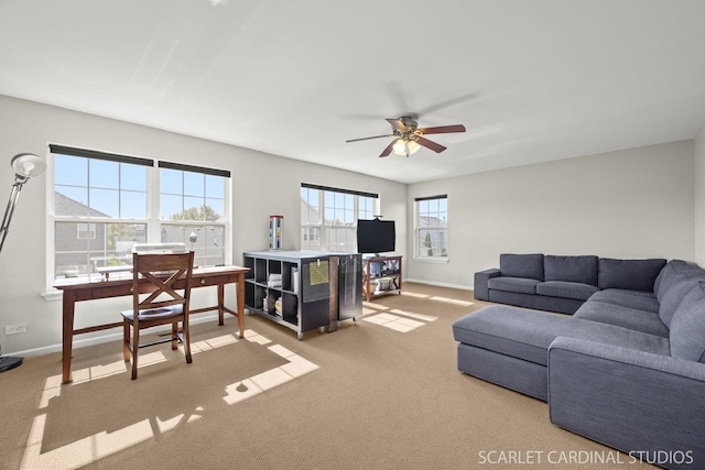 carpeted living room featuring ceiling fan