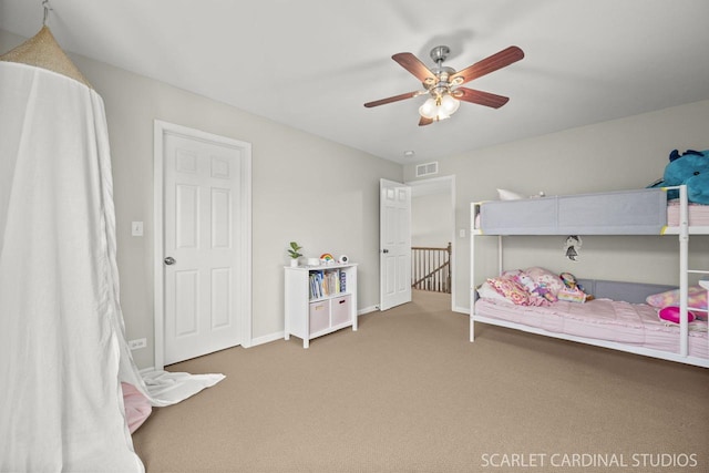 carpeted bedroom with ceiling fan