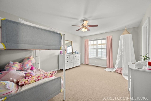 bedroom featuring ceiling fan and light colored carpet