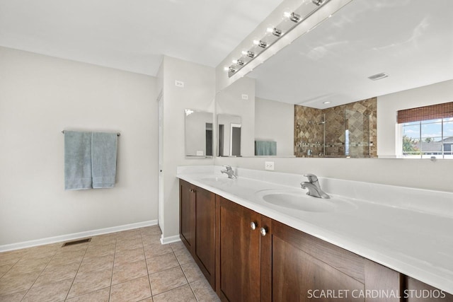 bathroom featuring vanity, tile patterned floors, and walk in shower