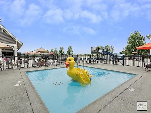 view of swimming pool featuring a patio area