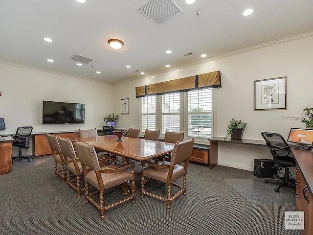 dining space featuring ornamental molding and dark colored carpet