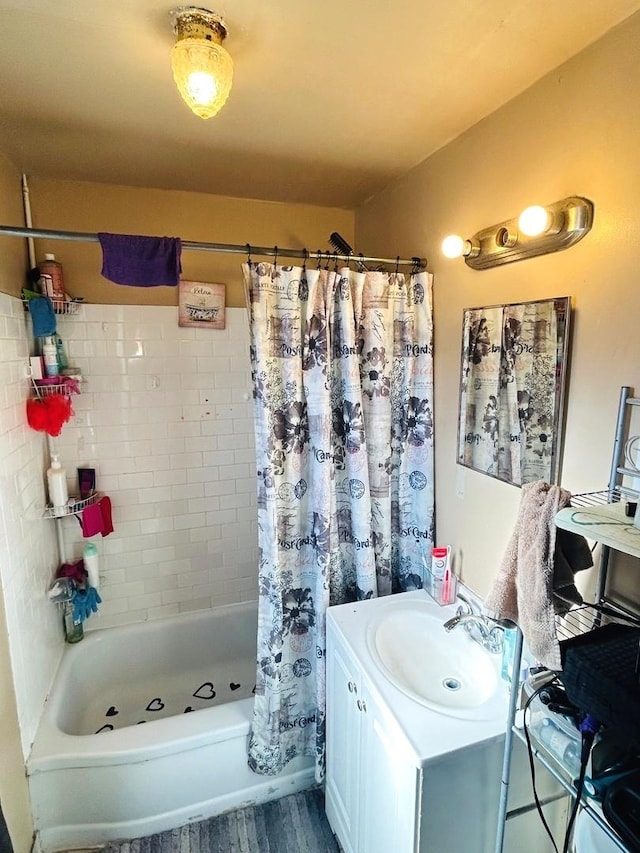 bathroom featuring vanity, wood-type flooring, and shower / tub combo