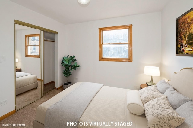 carpeted bedroom with multiple windows and a closet