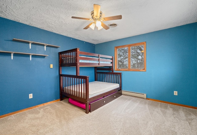 unfurnished bedroom with baseboard heating, carpet, and a textured ceiling