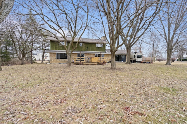 rear view of property with a wooden deck