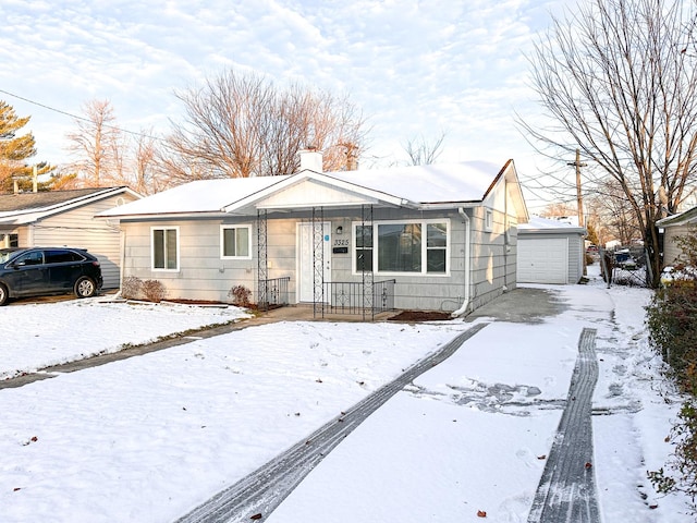 view of front of home featuring an outbuilding and a garage